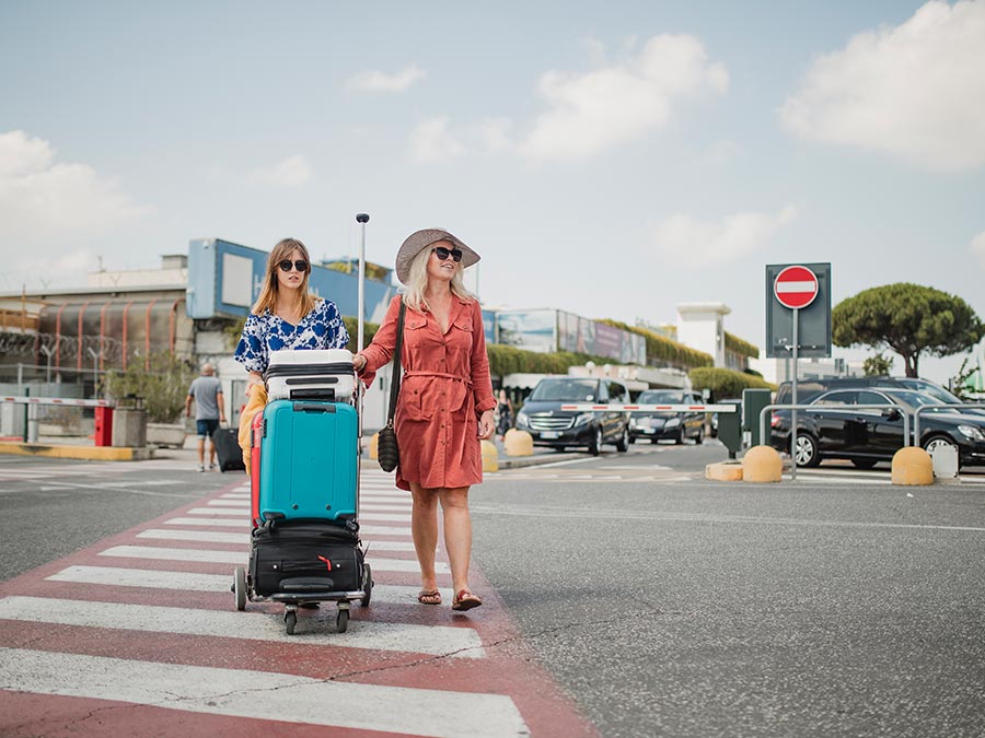 Two ladies in an airport carpark