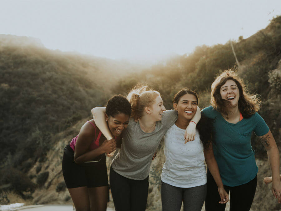 Happy group of girls hiking