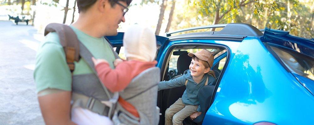 Parent and children getting out of a car