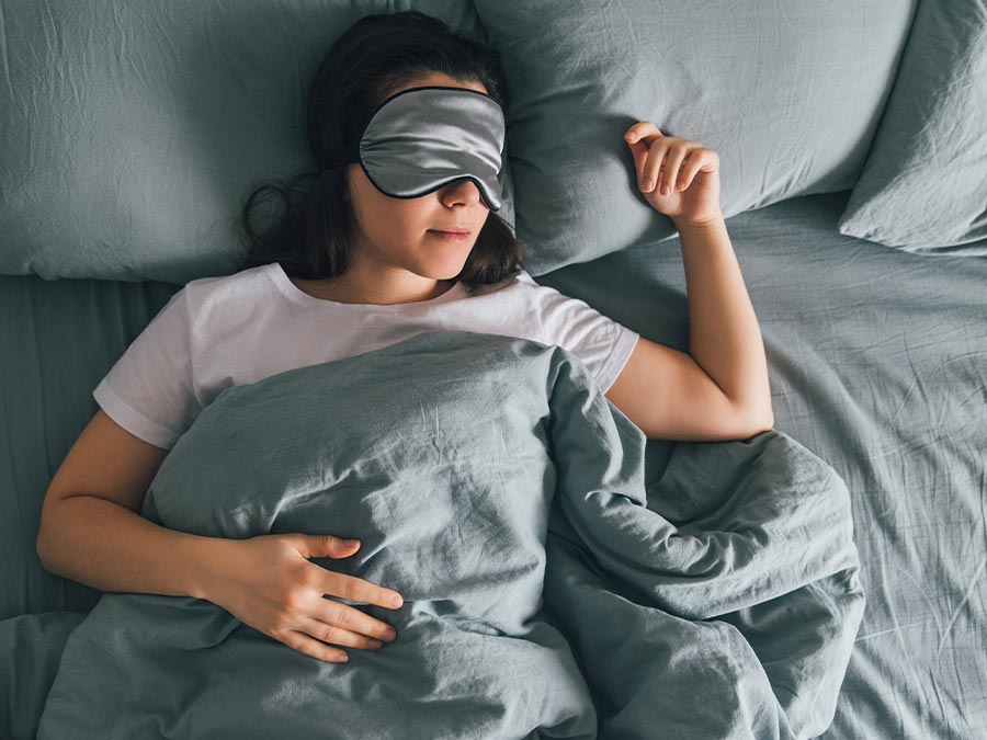 Female sleeping in bed