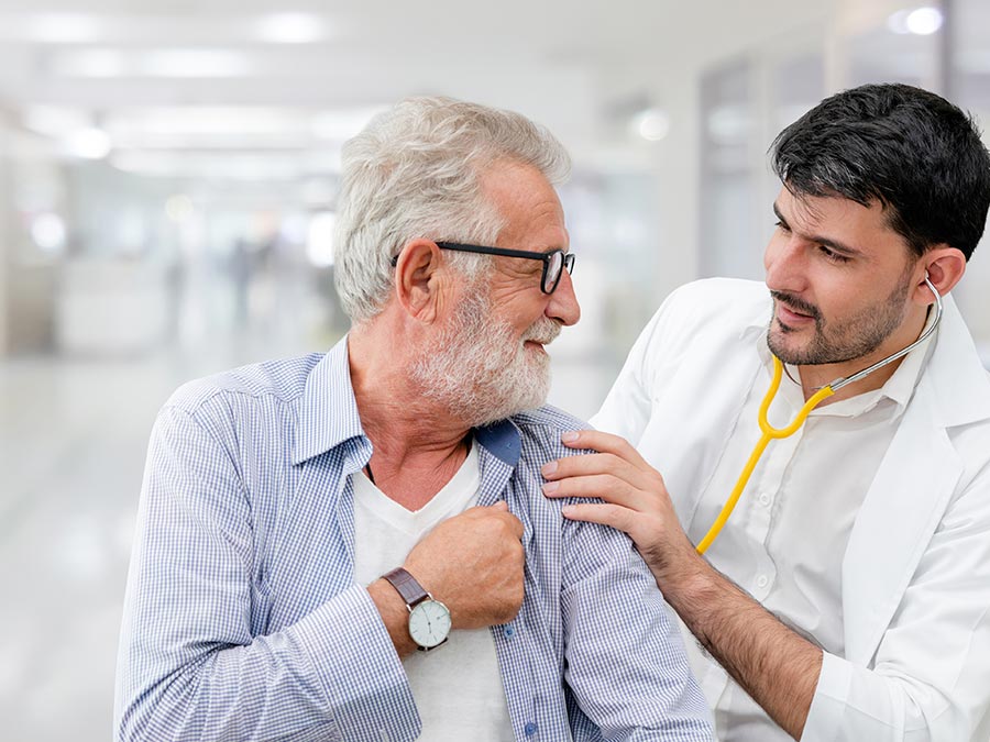 Senior man visiting the doctor for a health check