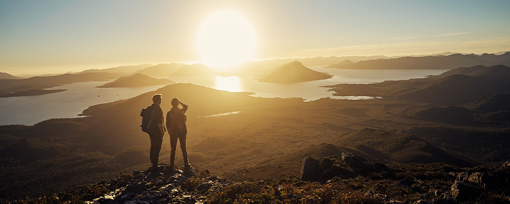 Couple looking out at Cradle Mountain